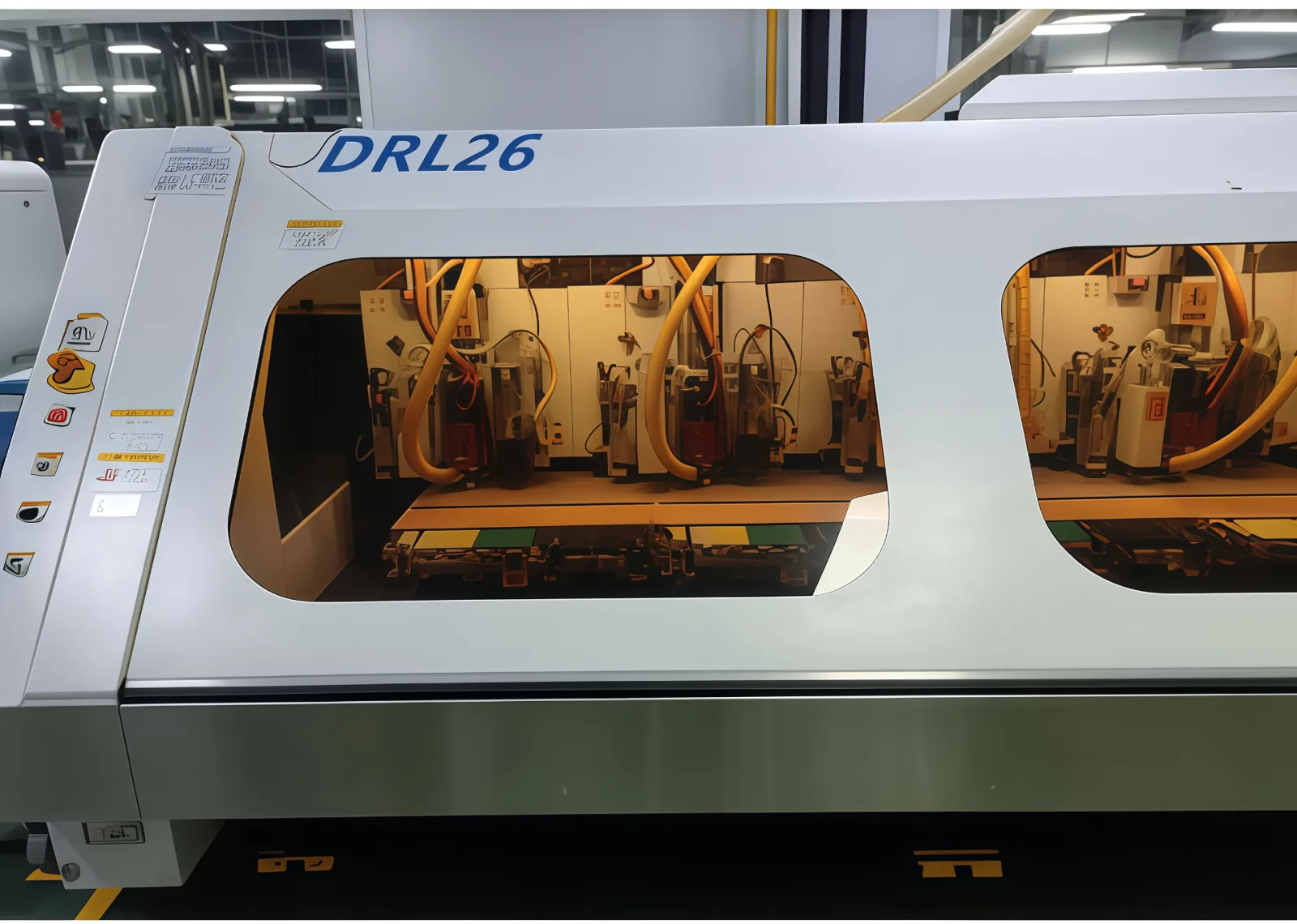 DRL26 high-precision CNC PCB drilling machine with inspection window showing drill spindles